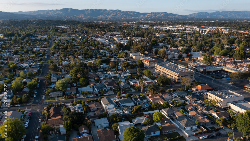 Los Angeles, California, USA - May 7, 2023: Sunset light shines on businesses in the urban core of downtown Canoga Park.