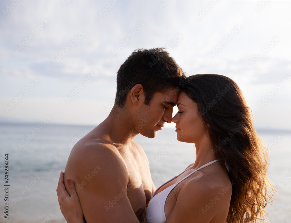 Beach, date and couple with love on holiday, vacation or travel to sea together in summer. Romantic, moment and man with gratitude for woman and embrace with kindness, care and support for partner Beach, date and couple with love on holiday, vacation or travel to sea together in summer. Romantic, moment and man with gratitude for woman and embrace with kindness, care and support for partner