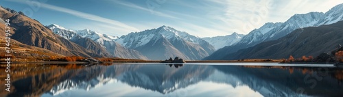 : A serene mountain landscape with a tranquil lake reflecting the snow-capped peaks in UHD quality.