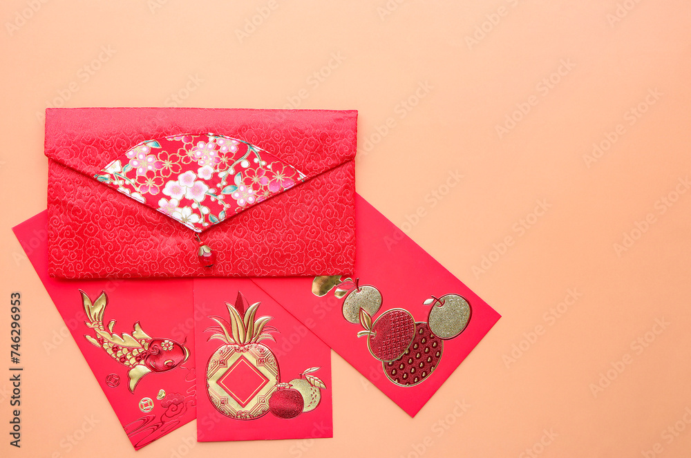 Red envelope in Chinese new year festival. red envelope on light brown background. Translate