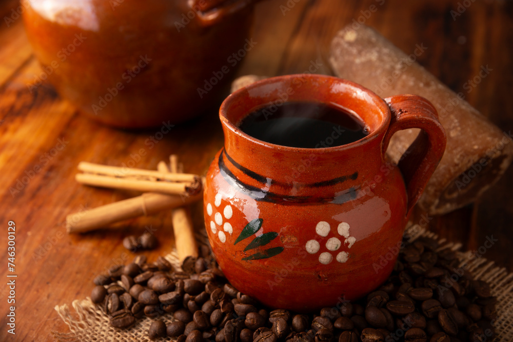 Mexican coffee with cinnamon and piloncillo known as Cafe de Olla. - obrazy, fototapety, plakaty 