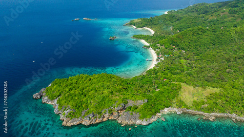 Rocky coastal with turquoise water and sandy beach in Cobrador Island. Romblon, Philippines. © MARYGRACE