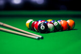 Many colorful billiard balls and cue on green table