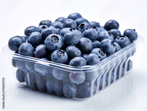 A transparent clamshell package filled with ripe blueberries, showcasing their vibrant deep blue color.