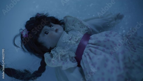 Scary old porcelain doll sinking.