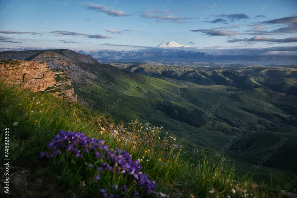 Caucasus mountains nature unveils its breathtaking beauty in every season. Vibrant wildflowers blooming in alpine meadows to majestic mountains towering against the azure sky