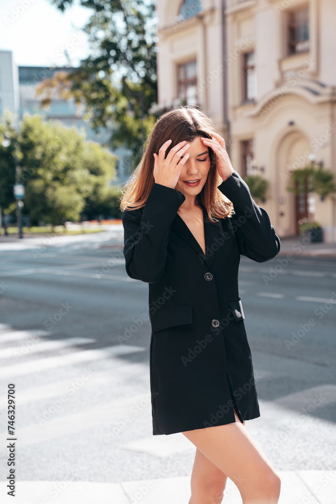 Portrait of young beautiful brunette woman wearing nice trendy suit black jacket clothes. Sexy confident model posing in the street at sunny day. Fashionable female outdoors. Portrait of young beautiful brunette woman wearing nice trendy suit black jacket clothes. Sexy confident model posing in the street at sunny day. Fashionable female outdoors.