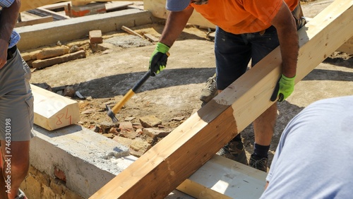 renovating a roof - construction site, workers at work