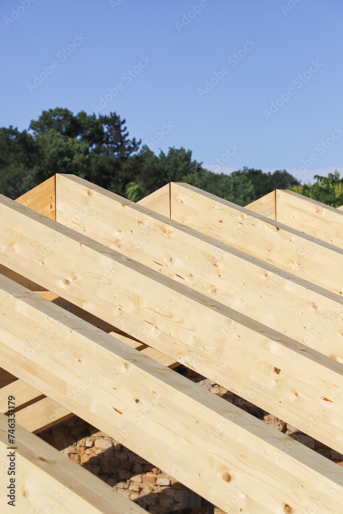 new house under construction. construction site - renovation of a roof - wooden beams
