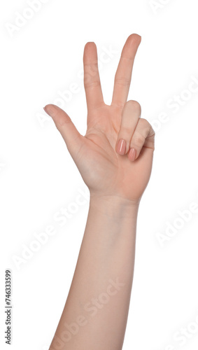 Playing rock, paper and scissors. Woman making scissors with her fingers on white background, closeup