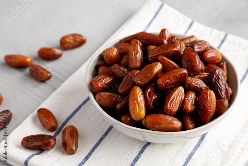 Organic Raw Date Fruit in a Bowl, side view.