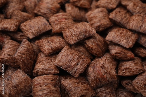 Tasty chocolate cereal pads as background, closeup