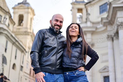 Happy  Beautiful Tourists  couple traveling at Rome, Italy, taking a selfie portrait  at Piazza del Popolo.Visiting Italy - man and woman enjoying weekend vacation - Happy lifestyle concept  © Striker777