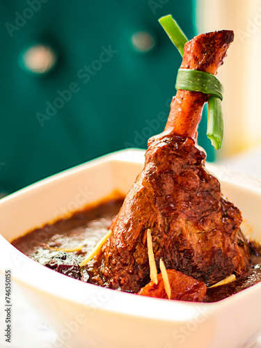 LAMB shank Tagen served in dish isolated on table closeup top vie of arabic spicy food photo