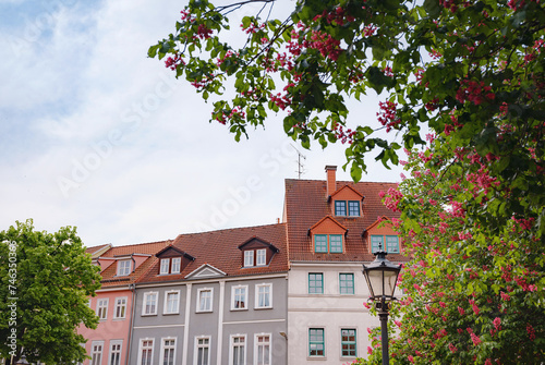 spring trip to Europe. Travel and German sightseeing locations. scenic view to facade of old historic houses somewhere in Erfurt city, Traditional half-timbered houses makes cozy and fairy tail mood