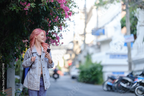 Woman using smartphone on the street.