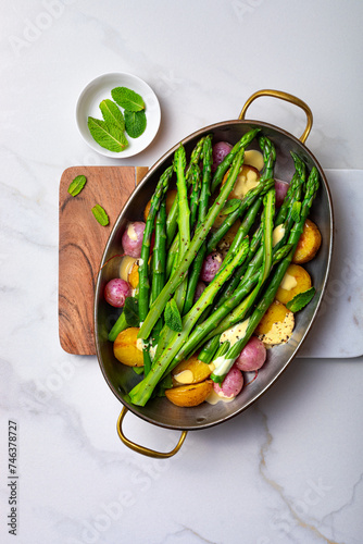 Roasted spring vegetables - asparagus, radishes, baby potatoes with hollandaise sauce