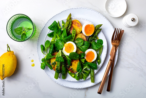 Grilled green asparagus, roasted new baby potatoes, fresh corn salad leaves, soft boiled egg, peas and green herb oil salad.