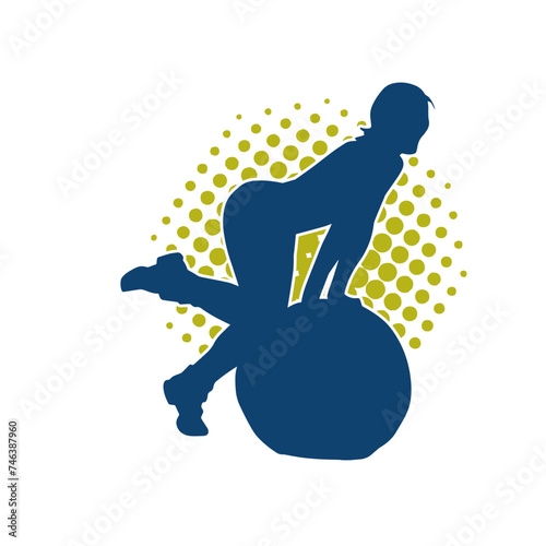 Silhouette of a slim sporty woman doing pilates exercise using gym ball. Silhouette of a sporty female doing physical exercise using fitness ball. 