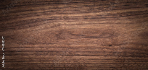 Walnut wood texture background. Wide format black walnut natural texture desktop background. 