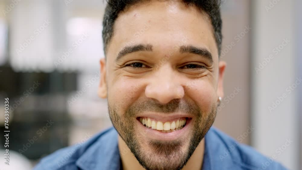 Hispanic man smiling at camera working in a coworking Hispanic man smiling at camera working in a coworking