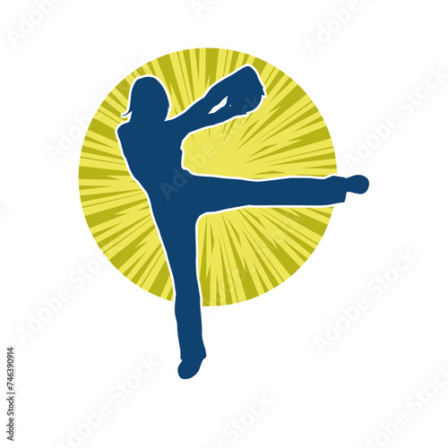 Silhouette of a slim sporty woman doing pilates exercise using gym ball. Silhouette of a sporty female doing physical exercise using fitness ball. 