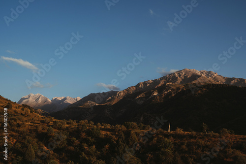 landscape with mountain peaks background the sky with clouds at sunset in autumn