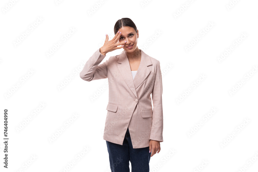 young cheerful smiling european brunette woman dressed in a stylish beige jacket young cheerful smiling european brunette woman dressed in a stylish beige jacket