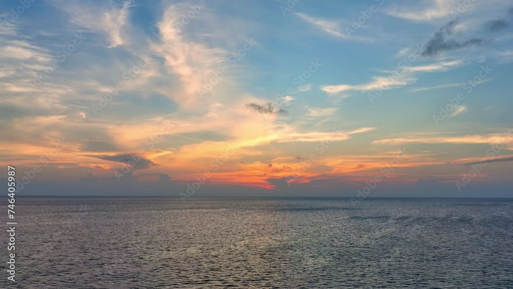 Vast expanse of ocean meets painted sky at sunset. A mesmerizing blend of blue, yellow, and red hues captured from above by a drone. Nature stock footage. Summer sea background. 4K.
Vast expanse of ocean meets painted sky at sunset. A mesmerizing blend of blue, yellow, and red hues captured from above by a drone. Nature stock footage. Summer sea background. 4K.