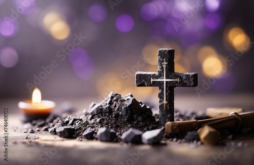 Christian cross made of charcoal dust with candlelight