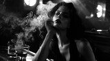 Seductress in Noir: A Dark Femme Fatale Sits in a Noir Bar, Exuding Mystery and Allure, Capturing the Intrigue of Classic Film Noir Aesthetics