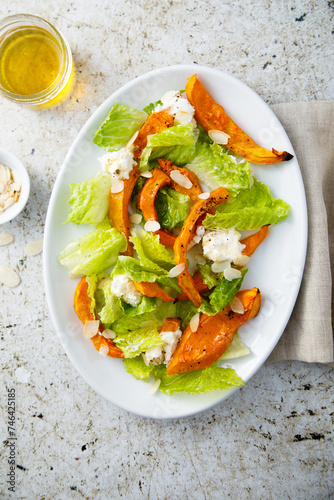Healthy salad with roasted pumpkin and almond
