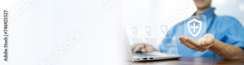 Doctor working with laptop computer Hospital background. Doctor insurance healthcare concept.