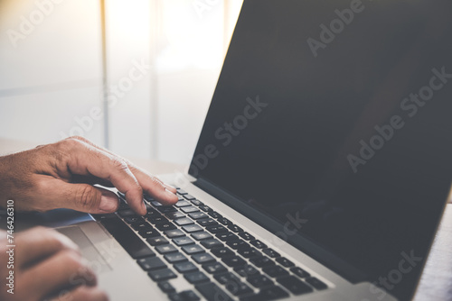 Man writing with laptop. Closeup of hands typing on keyboard. Technology, business, work, concept.