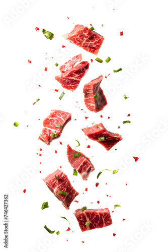 Slices of Fresh raw beef meat levitation isolated on white background