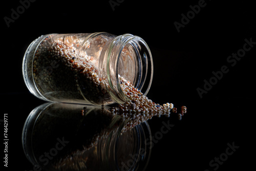 a pile of millet seeds for bird feed, small millet seeds, a pile of bird feed seeds