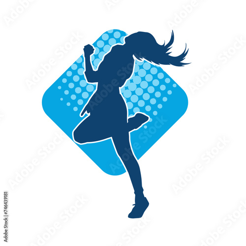 Silhouette of a slim female in dance pose. Silhouette of a woman dancing. photo