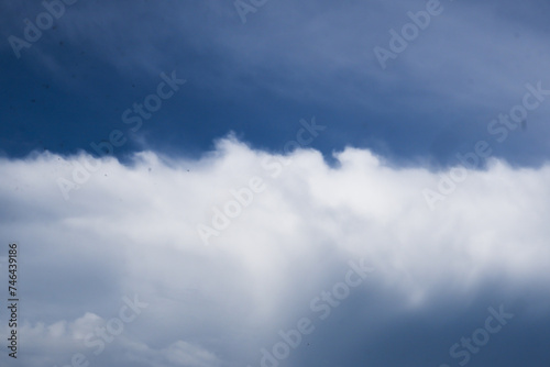 Fototapeta Naklejka Na Ścianę i Meble -  Thick white clouds in the blue sky