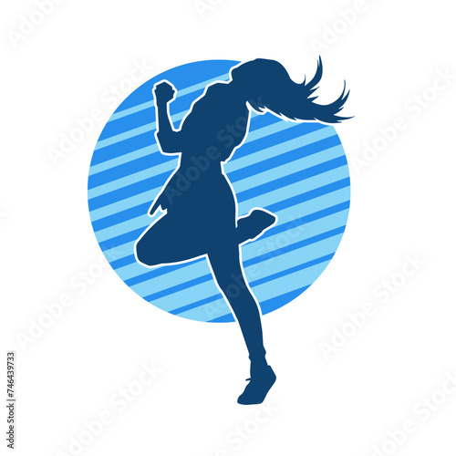 Silhouette of a slim female in dance pose. Silhouette of a woman dancing. photo