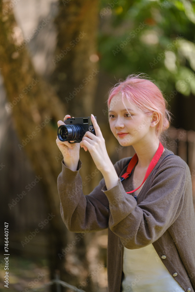 Beautiful woman with camera. Happy smiling woman taking photos of beautiful location. Beautiful woman with camera. Happy smiling woman taking photos of beautiful location.