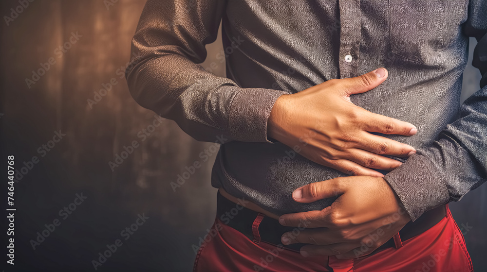 Man clutching stomach in pain