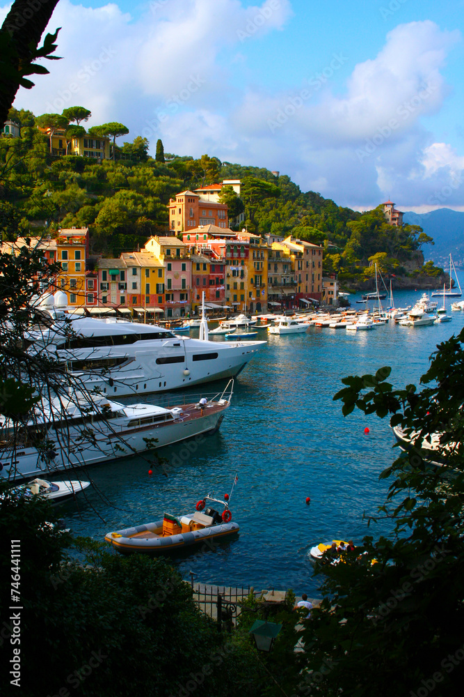 Portofino, Italy. Colorful houses, villas, yachts and luxury boats in the small port of the bay. Liguria, Italy, Europe