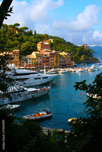 Portofino, Italy. Colorful houses, villas, yachts and luxury boats in the small port of the bay. Liguria, Italy, Europe