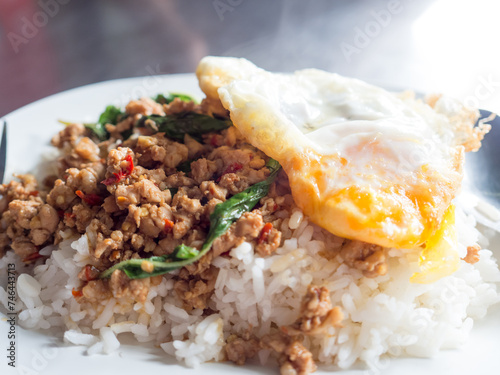Local Thai rice topped with stir-fried pork basil and fried egg.