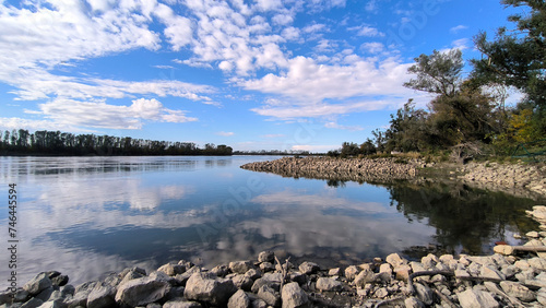 blue sky and white clouds reflected in Danube river in Vojvodina