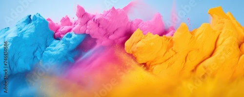 Colorful powder background  blue  yellow  pink. Holi powder.