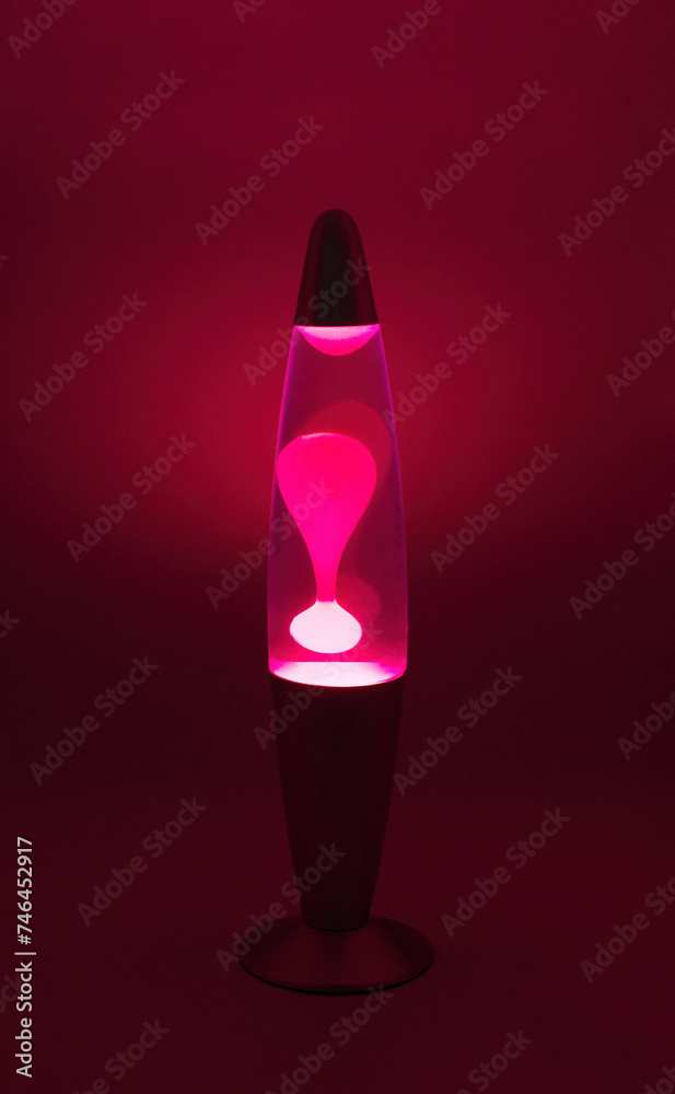 Lava lamp lavalamp red purple volcano color isolated retro vintage style from the 1960s and 1970s, hippie peace generation interesting heated wax in liquid oil water forms bubble globs that suspend - obrazy, fototapety, plakaty 