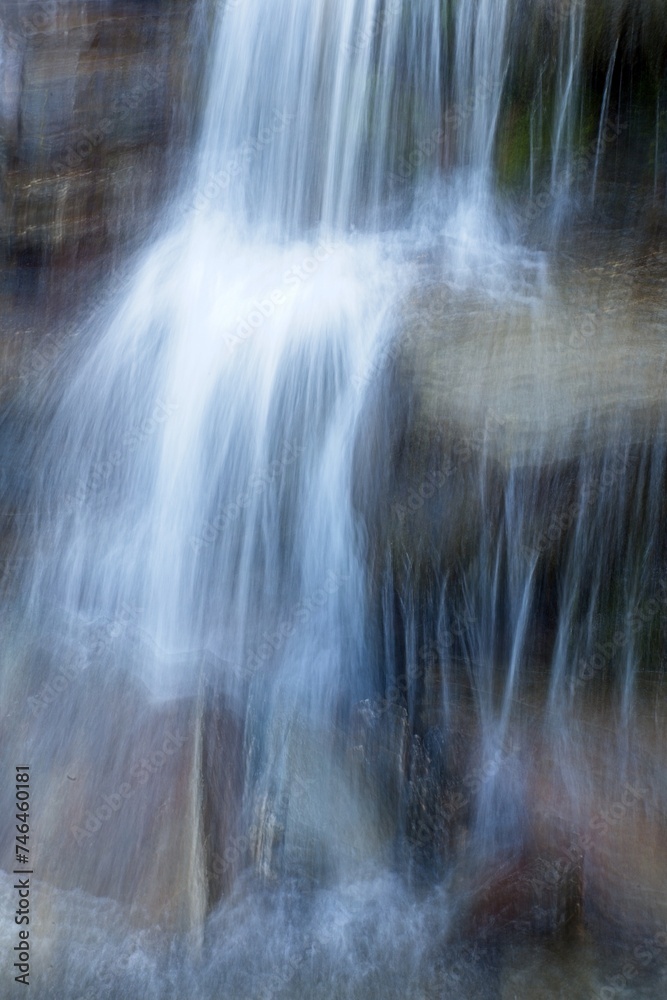 Long exposer closeup of small waterfall in mountain stream in summer. Long exposer closeup of small waterfall in mountain stream in summer.