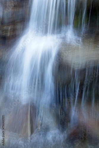 Long exposer closeup of small waterfall in mountain stream in summer.