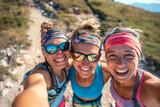Photo of three happy girls taking selfie while running